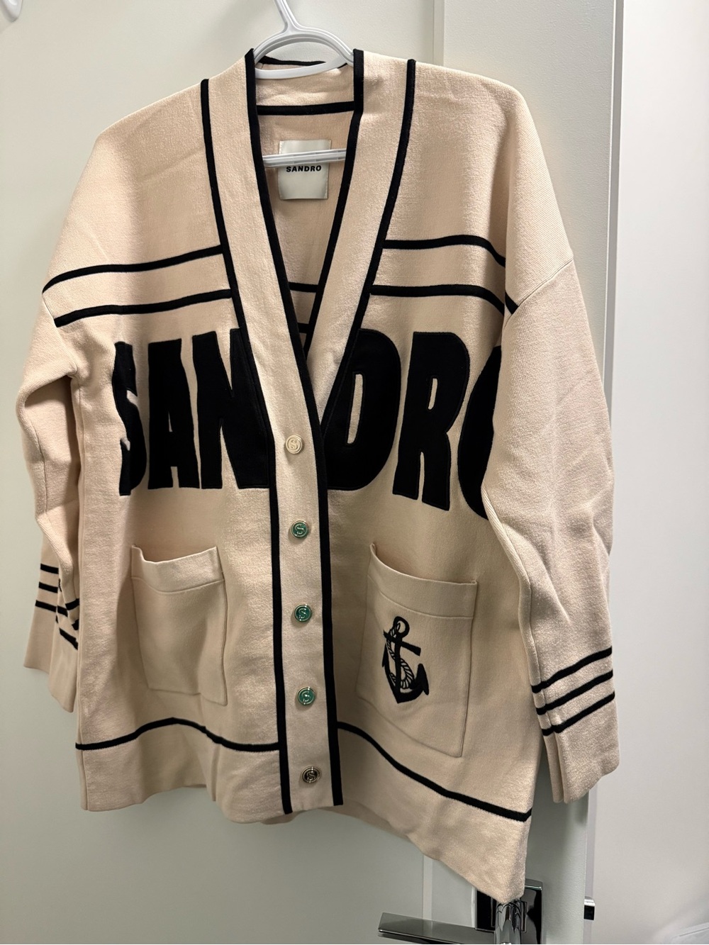 Sandro Cream Cardigan with Black Logo Trim and Anchor Pocket